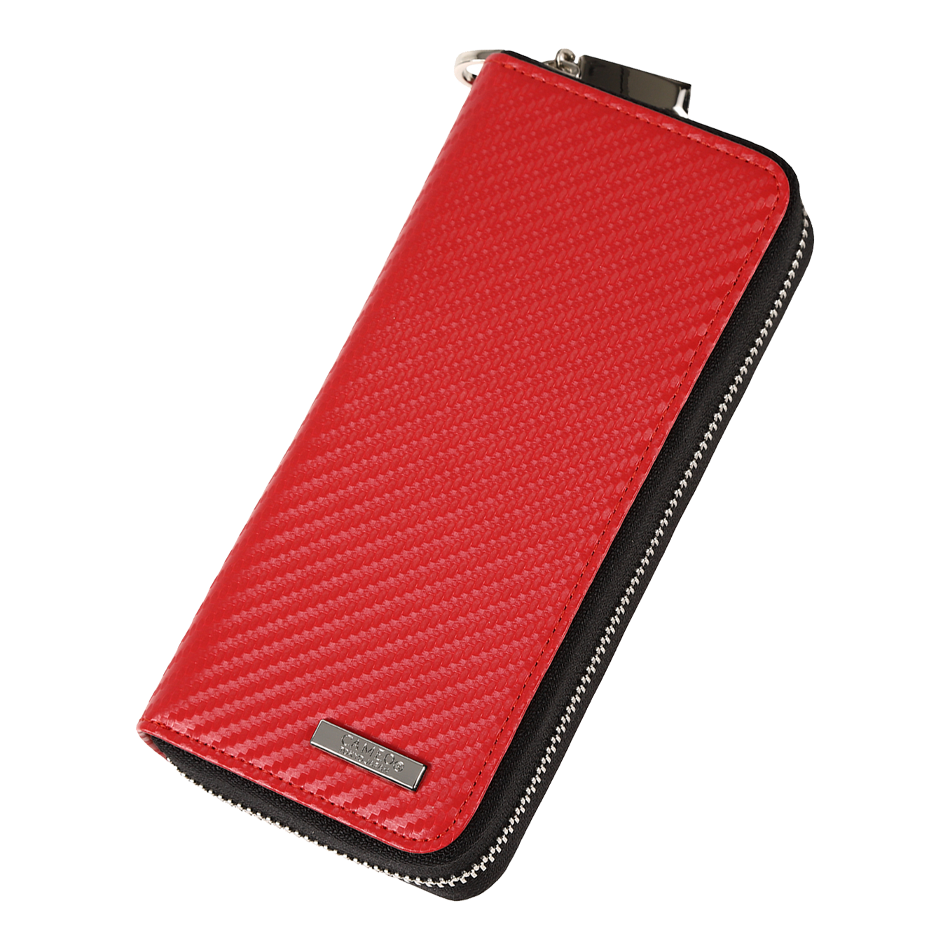 Caso de negocio Cameo Pro3 Das Bild zeigt ein rotes Etui mit einer strukturierten Oberfläche und einem Reißverschluss. An der unteren Ecke befindet sich ein kleines Metallschild mit einer Gravur.