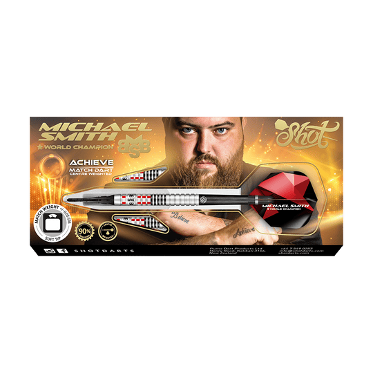 Shot de Michael Smith Achieve Soft Darts Auf dem Bild ist eine Packung mit Softdarts der Marke Shot zu sehen, die vom Weltmeister Michael Smith beworben wird. Die Verpackung zeigt ein Bild von Michael Smith und hebt die Eigenschaften des Produkts hervor.