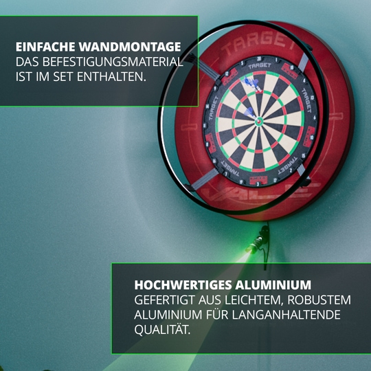 Láser de objetivo MOD Oche Das Bild zeigt eine Dartscheibe mit dem Target MOD Laser Oche an der Wand montiert. Es wird auf die einfache Wandmontage und das hochwertige Aluminium des Produkts hingewiesen.