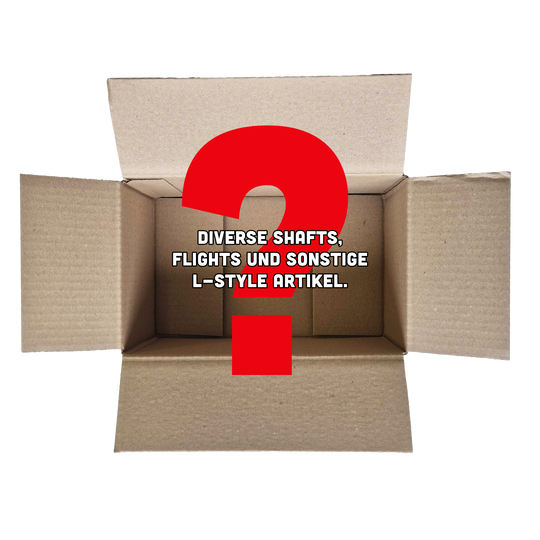 Caja misteriosa de McDart - Estilo L Das Bild zeigt einen offenen Karton mit einem großen roten Fragezeichen darin. In der Mitte steht der Text: "Diverse Shafts, Flights und sonstige L-Style Artikel."