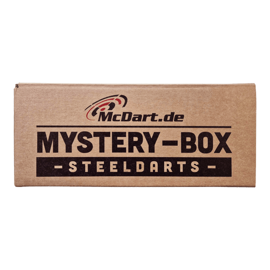 Caja misteriosa de McDart - Steeldarts Die Abbildung zeigt eine braune Box mit der Aufschrift „McDart Mystery-Box - Steeldarts“. Die Verpackung sieht einfach aus und ist speziell für Steeldarts-Fans gestaltet.