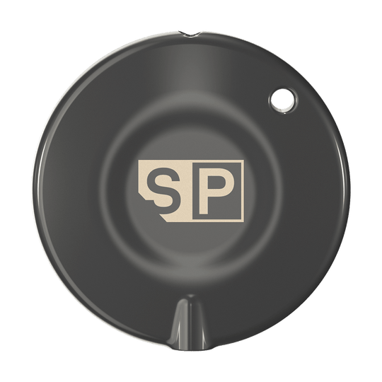 340007_Target_Swiss_Point_Key_Premium_1 Das Bild zeigt das Produkt "Target Swiss Point Key Premium". Es ist rund und schwarz mit einem "SP"-Logo in der Mitte.